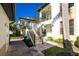 Condo building with stairs and lush landscaping at 129 Preserve Pl # A, Nokomis, FL 34275