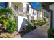 Condo entrance with stairs and landscaping at 129 Preserve Pl # A, Nokomis, FL 34275