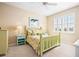 Charming bedroom with light green wooden bed frame and water view at 13489 Abercrombie Dr, Englewood, FL 34223