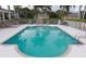 Refreshing community pool with lounge chairs and a relaxing atmosphere at 13489 Abercrombie Dr, Englewood, FL 34223