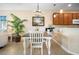 Charming dining area with a farmhouse table and chandelier at 13489 Abercrombie Dr, Englewood, FL 34223