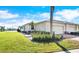 Two-car garage and attractive landscaping at 13489 Abercrombie Dr, Englewood, FL 34223