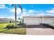 Two-car garage and a brick paved driveway at 13489 Abercrombie Dr, Englewood, FL 34223