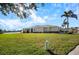 Single-story home with a large backyard and water view at 13489 Abercrombie Dr, Englewood, FL 34223