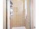 Large shower stall with beige tile walls at 13489 Abercrombie Dr, Englewood, FL 34223