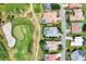 Aerial view of neighborhood homes and golf course at 13760 Long Lake Ln, Port Charlotte, FL 33953