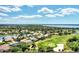 Stunning aerial of waterfront homes and golf at 13760 Long Lake Ln, Port Charlotte, FL 33953