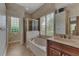 Bathroom with shower, tub, and updated vanity at 13760 Long Lake Ln, Port Charlotte, FL 33953