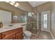 Large bathroom with walk-in shower and updated vanity at 13760 Long Lake Ln, Port Charlotte, FL 33953