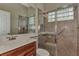 Bathroom boasts a large shower and updated vanity at 13760 Long Lake Ln, Port Charlotte, FL 33953