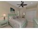 Light and airy bedroom with a ceiling fan and plenty of closet space at 13760 Long Lake Ln, Port Charlotte, FL 33953