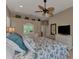 Primary bedroom with a floral comforter and white dresser at 13760 Long Lake Ln, Port Charlotte, FL 33953