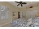 Bedroom with white dresser and blue floral bedding at 13760 Long Lake Ln, Port Charlotte, FL 33953