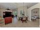 Bright dining area with glass-top table and wicker chairs at 13760 Long Lake Ln, Port Charlotte, FL 33953