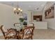 Bright dining room features a glass-top table and wicker chairs at 13760 Long Lake Ln, Port Charlotte, FL 33953