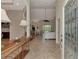 View of the entryway with tiled floor, a console table, and access to the living room and pool area at 13760 Long Lake Ln, Port Charlotte, FL 33953