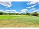 Picturesque golf course view with lush fairways at 13760 Long Lake Ln, Port Charlotte, FL 33953