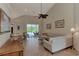 Living room with sectional sofa, coffee table, and access to the pool and lanai at 13760 Long Lake Ln, Port Charlotte, FL 33953