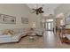 Spacious living room featuring a large sectional sofa and tile floors at 13760 Long Lake Ln, Port Charlotte, FL 33953