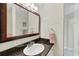 Bathroom with vanity sink and granite countertop at 142 Caddy Rd, Rotonda West, FL 33947