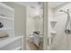 Bathroom with shower, toilet and built-in shelving at 142 Caddy Rd, Rotonda West, FL 33947