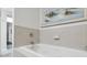 Bathroom with garden tub and tile surround at 142 Caddy Rd, Rotonda West, FL 33947