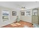 Bedroom with wood floors, window, and dresser at 142 Caddy Rd, Rotonda West, FL 33947