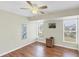 Bright bedroom with wood floors and two windows at 142 Caddy Rd, Rotonda West, FL 33947