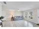 Living room with light colored walls, tile floor, and a couch at 142 Caddy Rd, Rotonda West, FL 33947