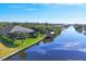 Aerial view of waterfront home with private dock and canal access at 14201 Joggins Ave, Port Charlotte, FL 33981