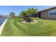 Landscaped backyard with lush lawn at 14201 Joggins Ave, Port Charlotte, FL 33981