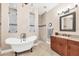 Elegant bathroom with freestanding tub and walk-in shower at 14201 Joggins Ave, Port Charlotte, FL 33981