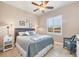 Bright bedroom featuring a king-size bed and window seating at 14201 Joggins Ave, Port Charlotte, FL 33981