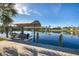 Private boat dock with covered lift and beautiful canal views at 14201 Joggins Ave, Port Charlotte, FL 33981