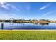 Scenic waterfront property with lush landscaping and canal views at 14201 Joggins Ave, Port Charlotte, FL 33981