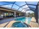 Spacious pool and patio with hot tub and outdoor seating at 14201 Joggins Ave, Port Charlotte, FL 33981