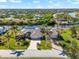 Aerial view of waterfront home showcasing canal and neighborhood views at 14216 Aurella Cir, Port Charlotte, FL 33981