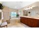 Elegant bathroom with double vanity and soaking tub at 14216 Aurella Cir, Port Charlotte, FL 33981