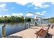 Private dock with lift and bench overlooking canal at 14216 Aurella Cir, Port Charlotte, FL 33981