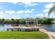 Private boat dock with lift and seating area at 14216 Aurella Cir, Port Charlotte, FL 33981