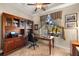 Home office with built-in wooden desk and large window at 14216 Aurella Cir, Port Charlotte, FL 33981