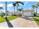 Single story home with attached garage and landscaping at 14216 Aurella Cir, Port Charlotte, FL 33981