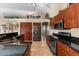 Modern kitchen with dark wood cabinetry and granite counters at 14216 Aurella Cir, Port Charlotte, FL 33981