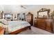 Main bedroom with a king bed and large dresser at 14216 Aurella Cir, Port Charlotte, FL 33981