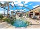 Inviting kidney-shaped pool with a waterfall feature at 14216 Aurella Cir, Port Charlotte, FL 33981