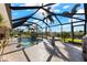 Relaxing screened pool area with spa and seating at 14216 Aurella Cir, Port Charlotte, FL 33981