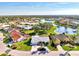 Lovely one-story home in a lakeside community, showcasing lush landscaping and neighborhood views at 1443 Quail Lake Dr, Venice, FL 34293