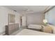 Bedroom features two twin beds, ceiling fan, closet, and dresser at 1443 Quail Lake Dr, Venice, FL 34293