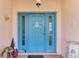 Inviting front entrance with light blue door and a cute welcome sign at 1443 Quail Lake Dr, Venice, FL 34293