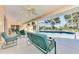 Covered lanai features views of pool and backyard at 1443 Quail Lake Dr, Venice, FL 34293